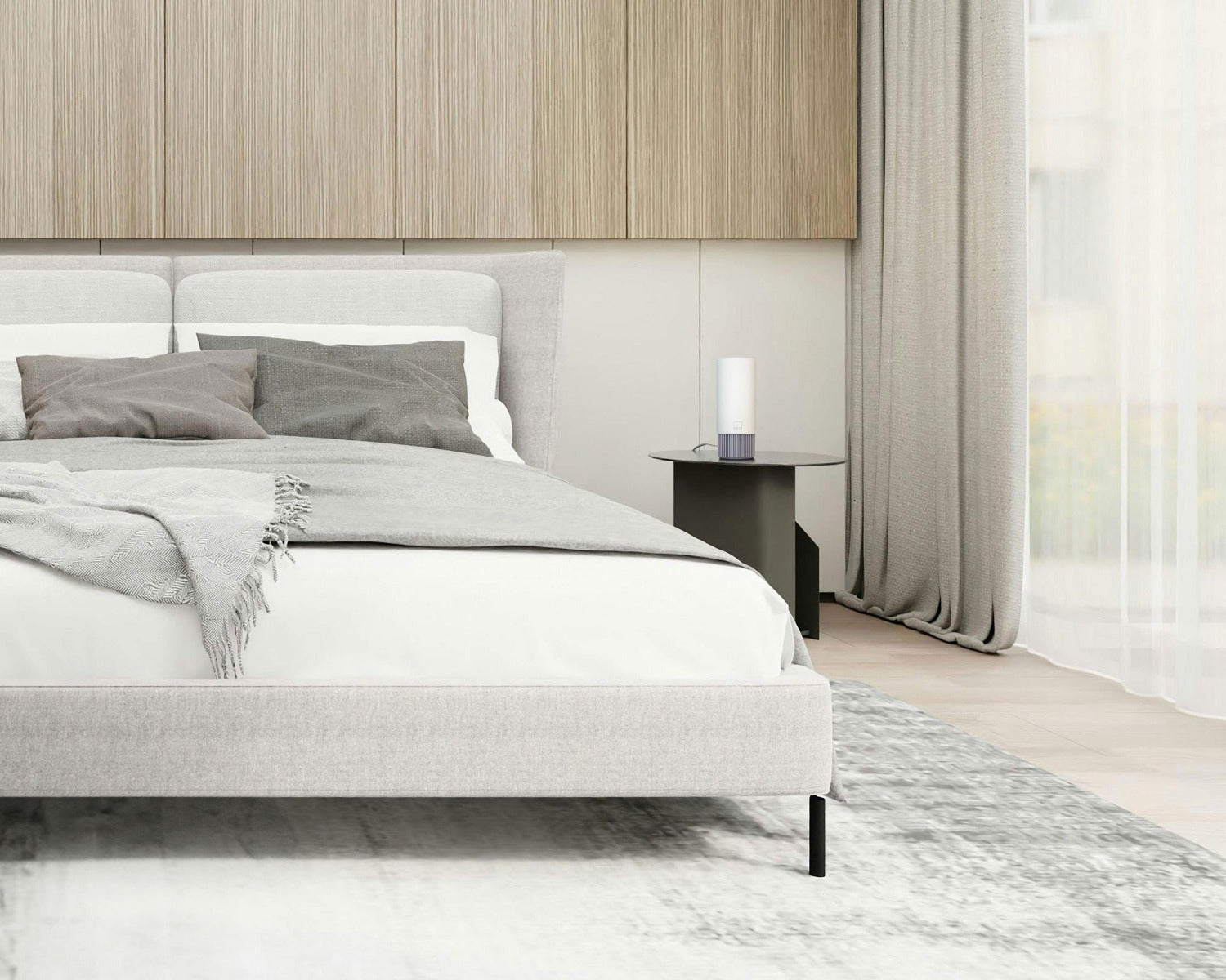 An Airea Space purifier on a modern hotel nightstand, cleaning the hotel room between guests arrive.