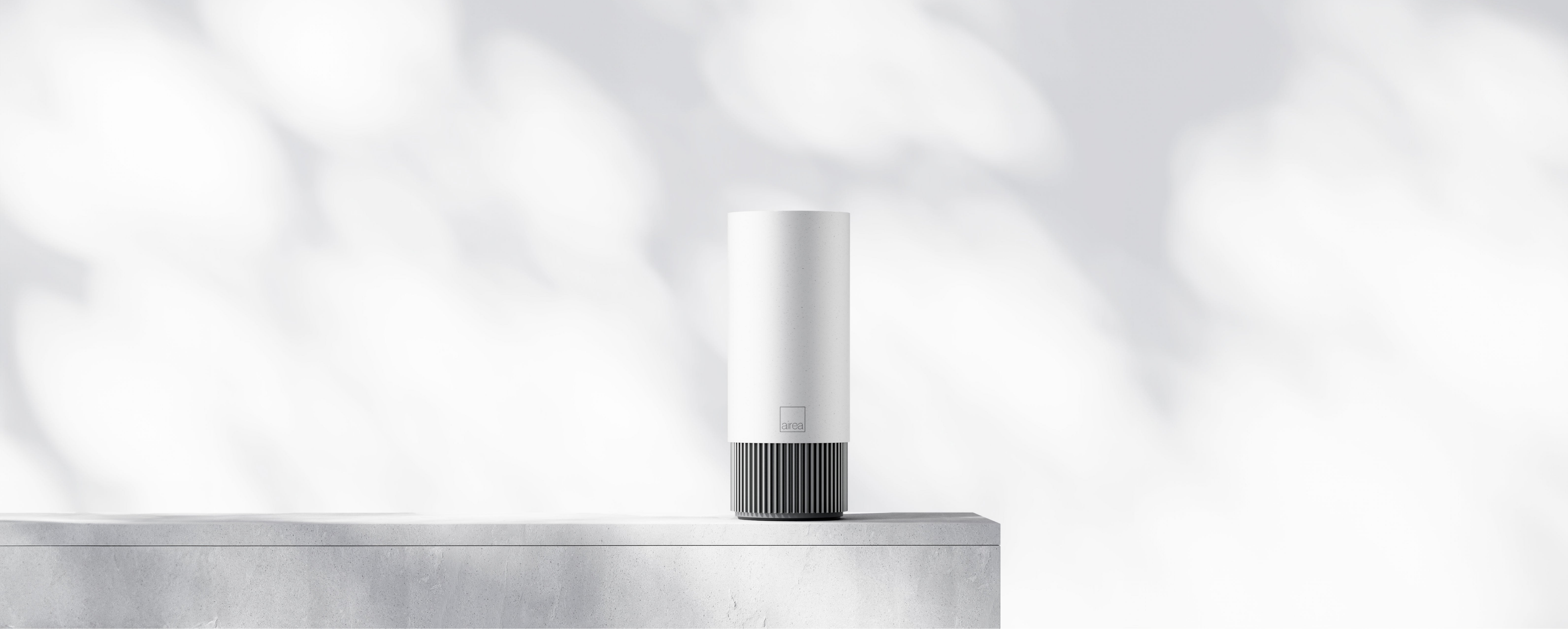 An Airea Space Purifier on a modern ledge.