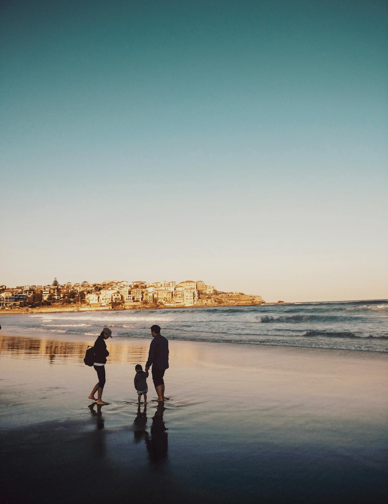 Family outdoors on beach in fresh air.